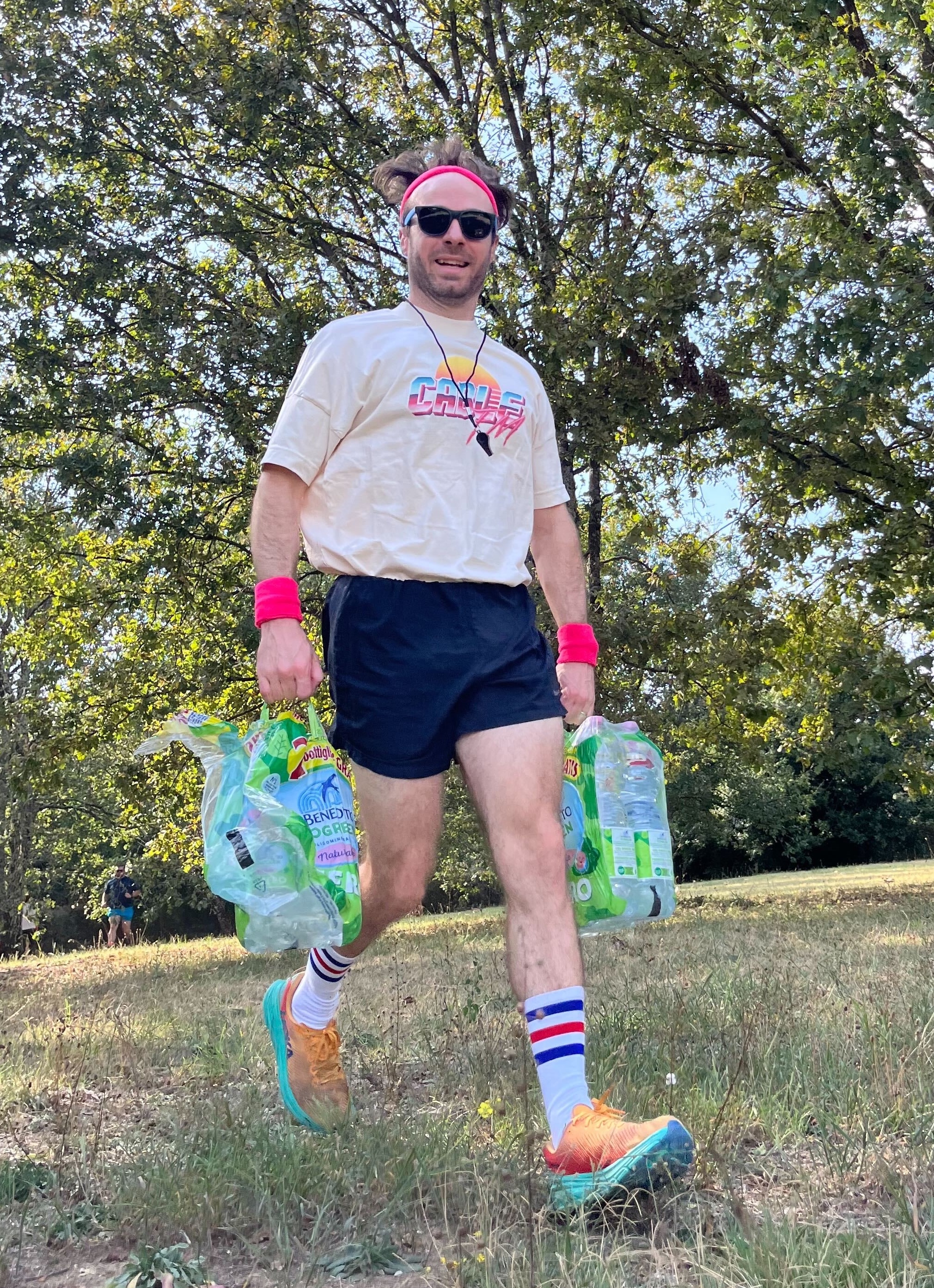 Randy in his signature camp counselor outfit with pink sweatbands and shorts, ready for action!